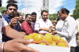 Leaders distributing sweets