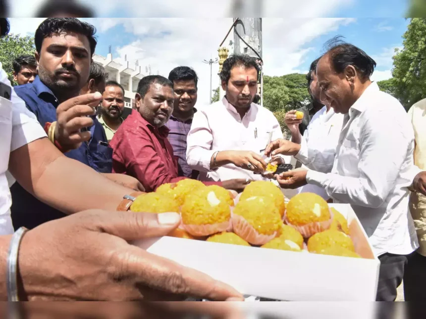 Leaders distributing sweets