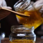 Bowls with natural ingredients like honey, turmeric, avocado, and cucumber for homemade facial masks