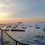 Scenic view of Upper Lake in Bhopal with boats and sunset