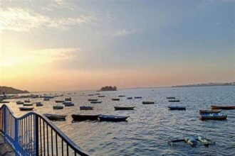 Scenic view of Upper Lake in Bhopal with boats and sunset