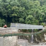 Vehicles crossing Sanklang Bridge after reopening in North Sikkim