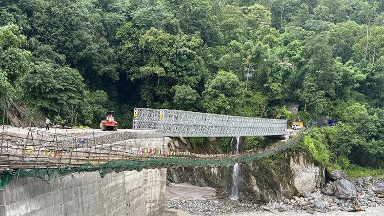Vehicles crossing Sanklang Bridge after reopening in North Sikkim