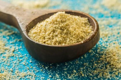 Asafoetida powder in a small bowl used for making Heeng water