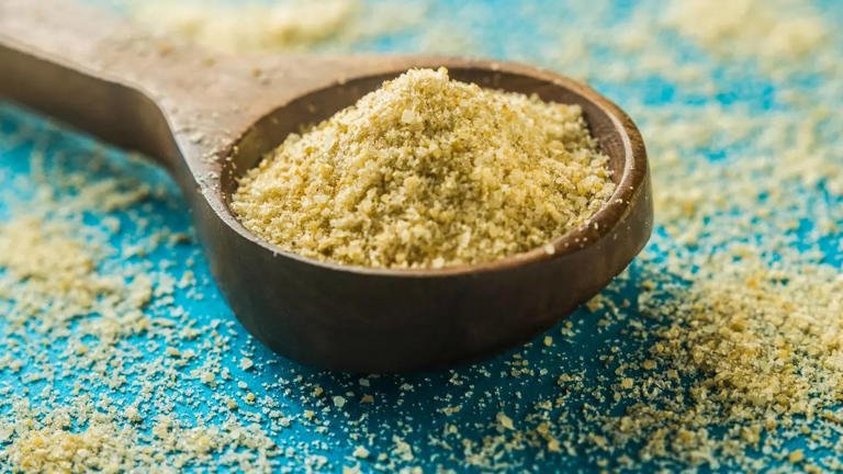 Asafoetida powder in a small bowl used for making Heeng water