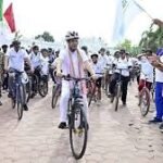 Participants riding bicycles during Fit India Cycling Event in Agartala