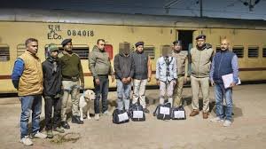 Railway Police (GRP) apprehending a suspected arms smuggler at Agartala Railway Station and seizing an illegal firearm