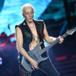 Def Leppard guitarist Phil Collen performing on stage and discussing his vegetarian lifestyle influenced by Indian culture.