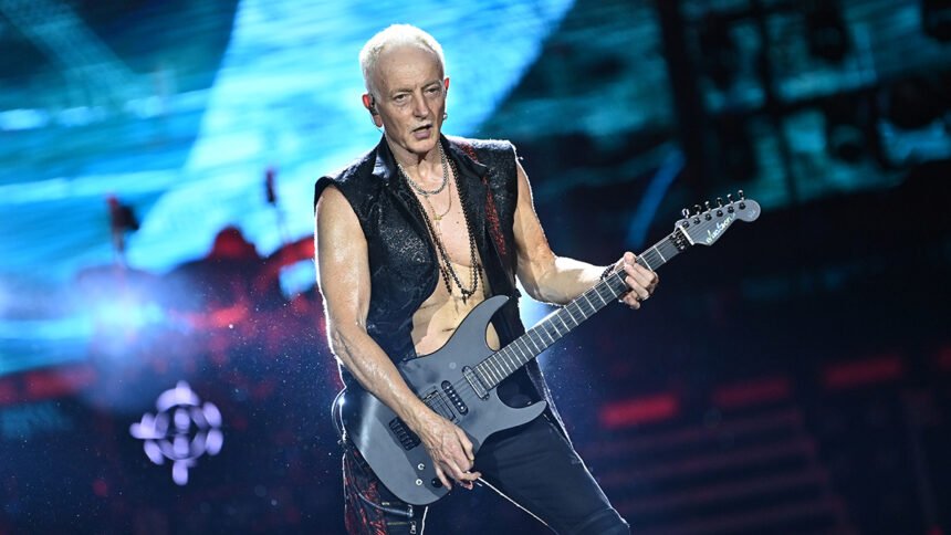 Def Leppard guitarist Phil Collen performing on stage and discussing his vegetarian lifestyle influenced by Indian culture.