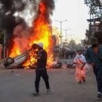 Crowd and police presence during violence in Mangalkhali North Tripura showing tense situation