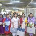 Security personnel and voters at polling booth during Tripura Dharmanagar bypoll amid cyclone precautions