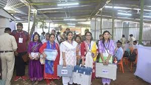 Security personnel and voters at polling booth during Tripura Dharmanagar bypoll amid cyclone precautions