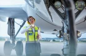 Engineers inspecting regional aircraft during safety maintenance checks