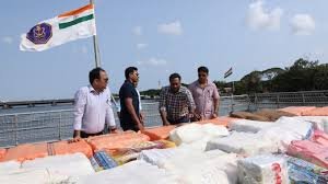Security forces displaying seized narcotics during anti drug operations India
