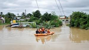 Severe Weather Flood Alert in Tripura showing heavy rain, flooded streets, and emergency response teams