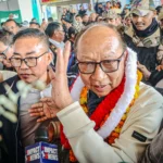 Yamnam Kimchan Singh taking oath during Manipur new leadership swearing ceremony