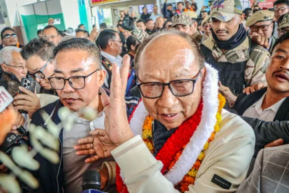 Yamnam Kimchan Singh taking oath during Manipur new leadership swearing ceremony