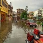 Waterlogged Agartala flyover with vehicles struggling amid leakage and heavy rain conditions