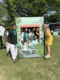 Students enjoying makeup trials and games during Influencer Yatra at Nagaon College