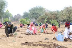 Youth planting trees during Earth Day celebration at Angaan Ching in Chandel