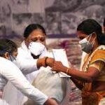 Community members providing financial aid to injured youth at hospital