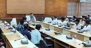 Dharmanagar SOP Meeting Updates showing officials discussing standard operating procedures for governance improvement