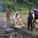 Nagaland police officers displaying seized heroin and opium during anti-narcotic operation