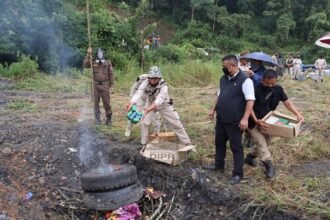 Nagaland police officers displaying seized heroin and opium during anti-narcotic operation