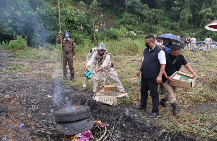 Nagaland police officers displaying seized heroin and opium during anti-narcotic operation