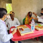 Doctors conducting affordable healthcare check-ups at a rural medical camp organized by Kolkata hospitals