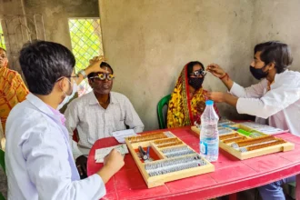 Doctors conducting affordable healthcare check-ups at a rural medical camp organized by Kolkata hospitals