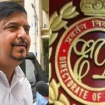 ED officials escort former West Bengal minister Sujit Bose during recruitment scam investigation