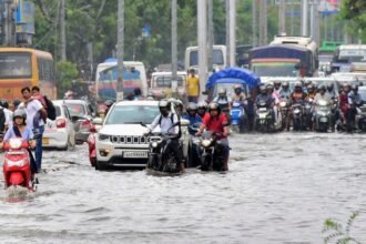 Heavy rainwater flooding streets and disrupting traffic in Guwahati during severe storm warning