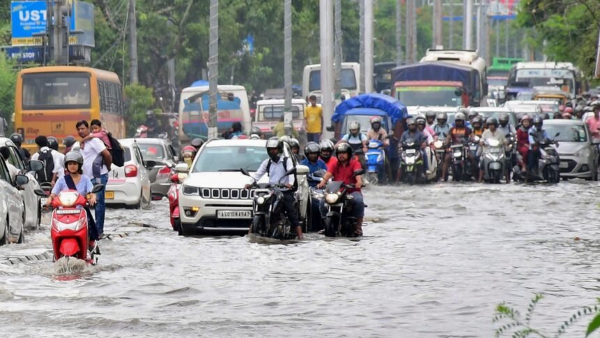 Heavy rainwater flooding streets and disrupting traffic in Guwahati during severe storm warning