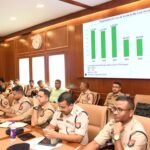 Assam Police officers reviewing criminal investigation records during statewide crime review meeting