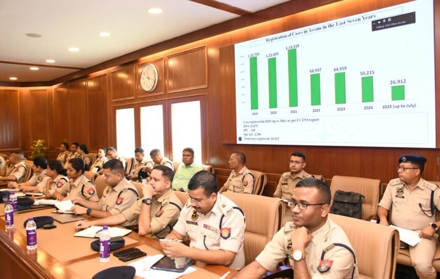 Assam Police officers reviewing criminal investigation records during statewide crime review meeting