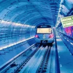 Modern Kolkata Metro train operating inside underwater tunnel beneath the Hooghly River during Green Line commercial services