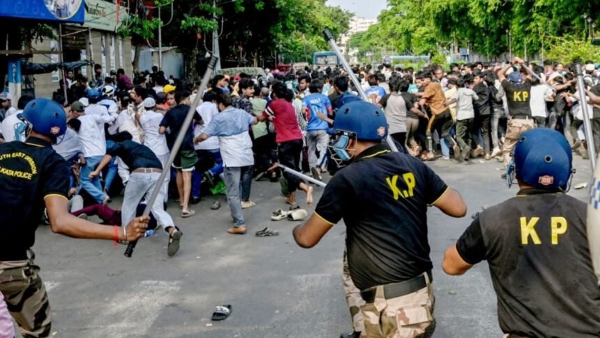 Kolkata Police personnel conducting investigation and security operations in Park Circus after violent protest