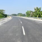 Road construction work underway in Assam under the Asom Mala 2.0 infrastructure development project