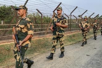 Security personnel and emergency responders near the Sonamura border area following a firing incident involving an injured youth