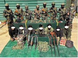 Security forces displaying seized firearm after arrest of Kuki National Army cadre in Churachandpur
