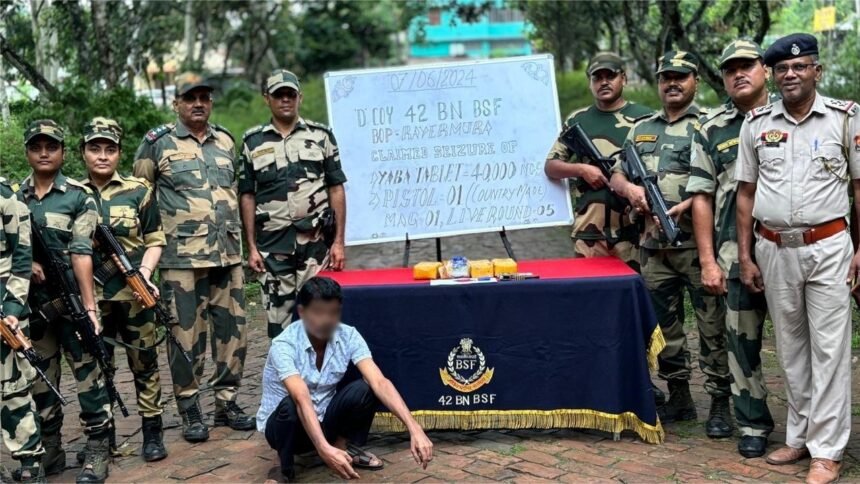BSF and Tripura Police personnel display seized Yaba tablets recovered near the border fencing in the Raghna area during an anti-narcotics operation.