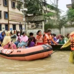 Heavy rainfall causing rising river levels and flood risks across Assam, Meghalaya, and Sikkim under IMD red alert warning.