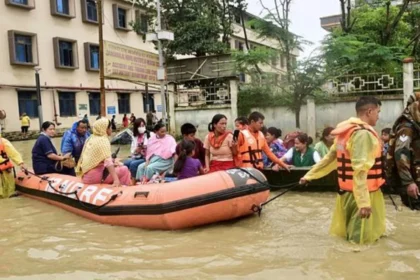 Heavy rainfall causing rising river levels and flood risks across Assam, Meghalaya, and Sikkim under IMD red alert warning.