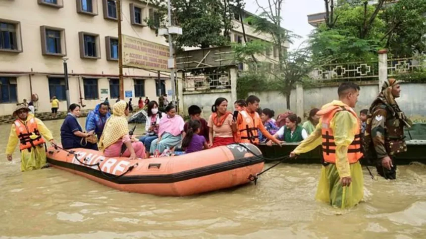 Heavy rainfall causing rising river levels and flood risks across Assam, Meghalaya, and Sikkim under IMD red alert warning.