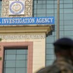 NIA officials conduct a pre-dawn search operation in Bishalgarh as part of an investigation into cross-border trafficking and smuggling activities.