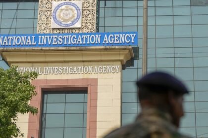 NIA officials conduct a pre-dawn search operation in Bishalgarh as part of an investigation into cross-border trafficking and smuggling activities.