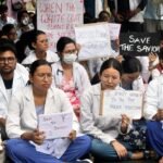 Medical students in Assam holding placards during a peaceful demonstration demanding transparent rural posting guidelines.