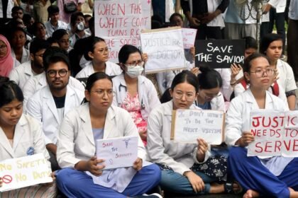 Medical students in Assam holding placards during a peaceful demonstration demanding transparent rural posting guidelines.