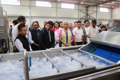 Nirmala Sitharaman inaugurating a large organic spice processing plant in Ri-Bhoi, Meghalaya, with officials and farmers present.